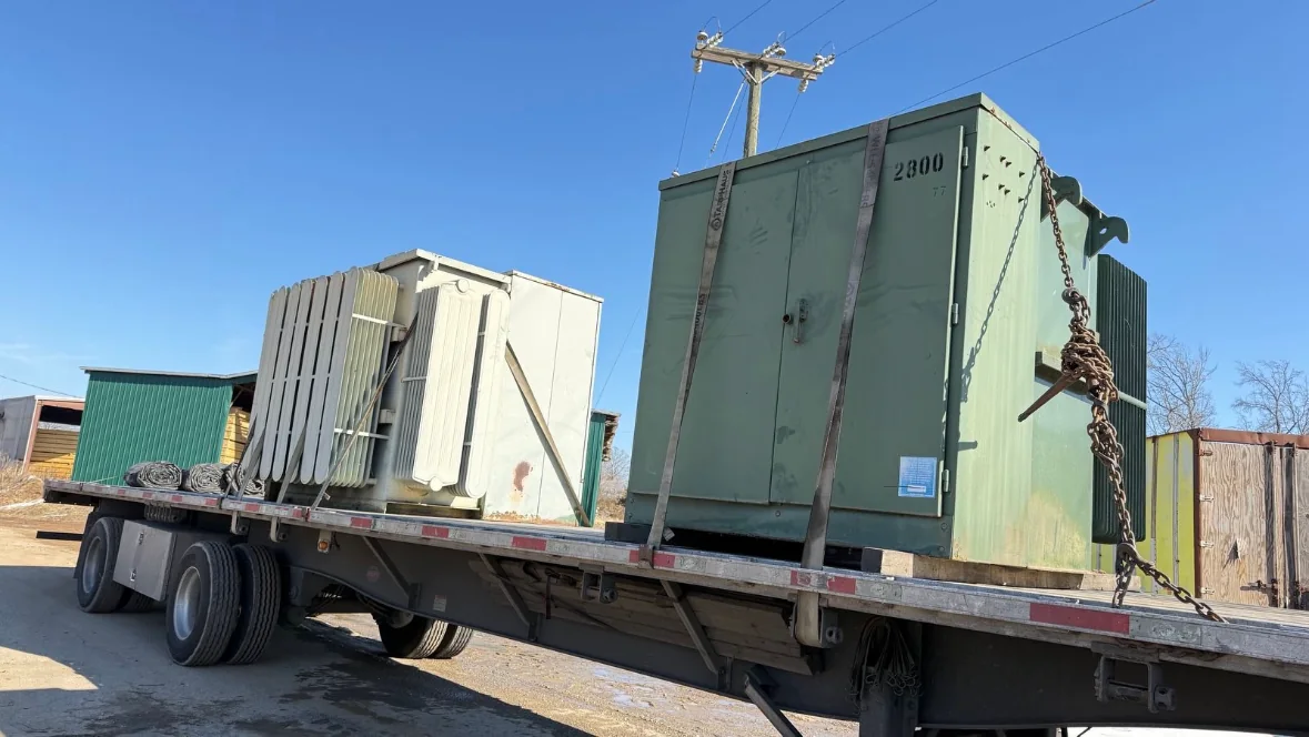 Pad-mounted electrical transformer staged for equipment evaluation
